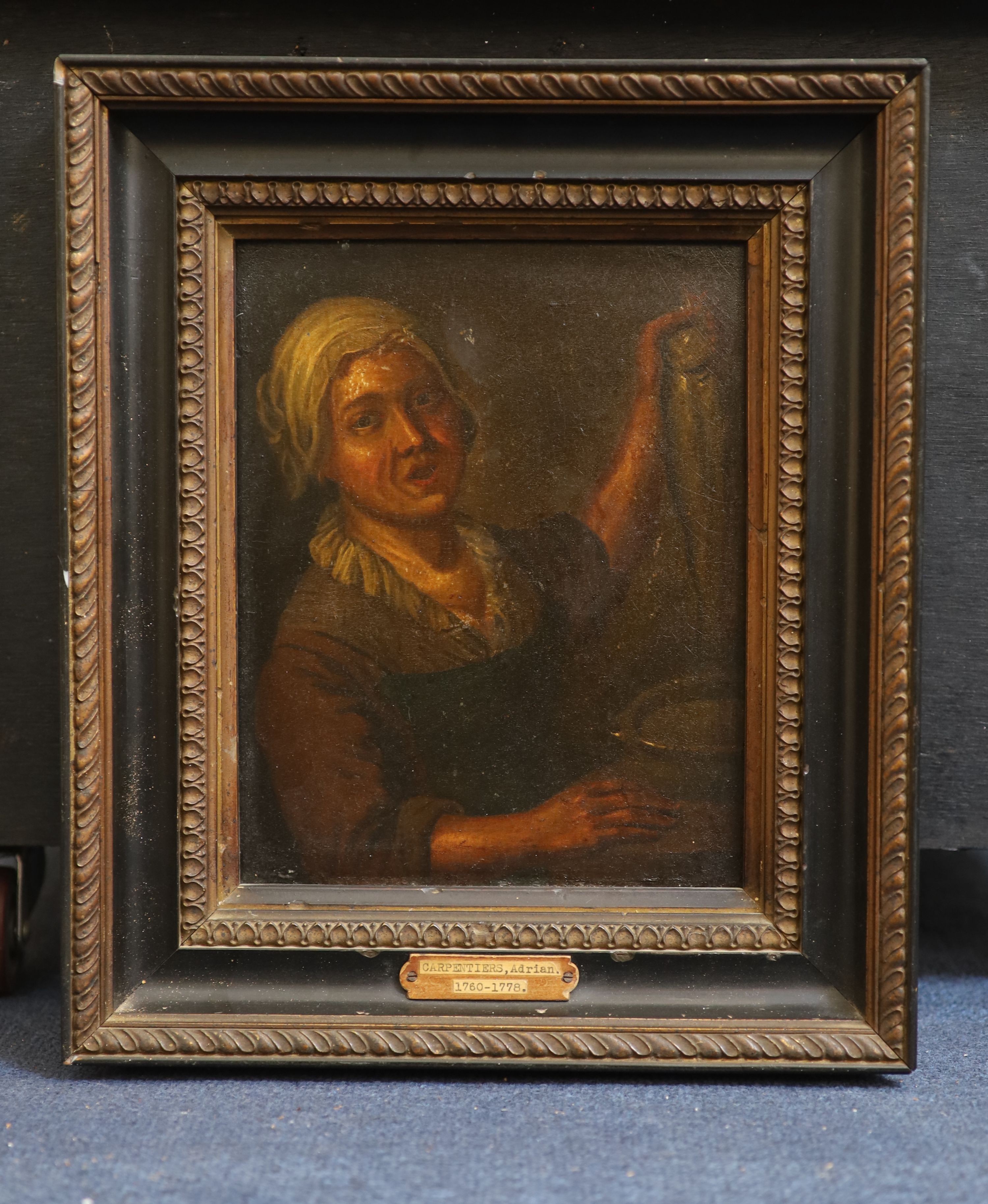 Attributed to Adrian Carpentiers (1760-1778), A woman holding a fish, Oil on wooden panel, 23.5 x 19cm